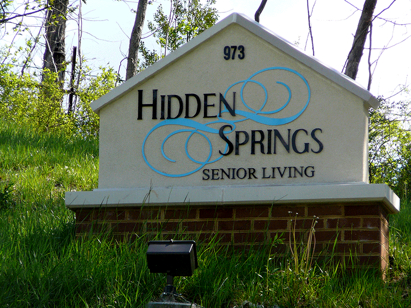 Road sign location of Hidden Springs location