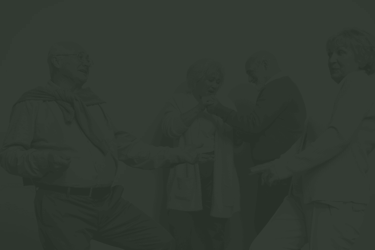 Four people are joyfully interacting indoors, engaging in conversation and laughter, creating a warm, lighthearted atmosphere. No landmarks or historical buildings visible.